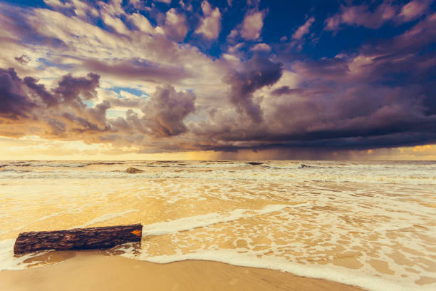 istock Beatiful sunset with clouds over sea and beach 1044955434