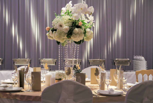 istock Wedding table flower decoration. Hydrangea, roses and orchid bouquet. Glamorous Event, celebration 1044960914