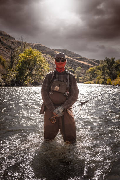 istock Tactical Fly Fisherman In The River 1044964702