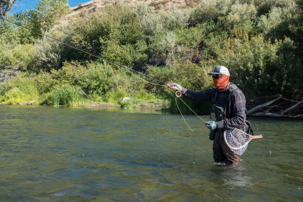 istock Tactical Fly Fisherman In The River 1044964784