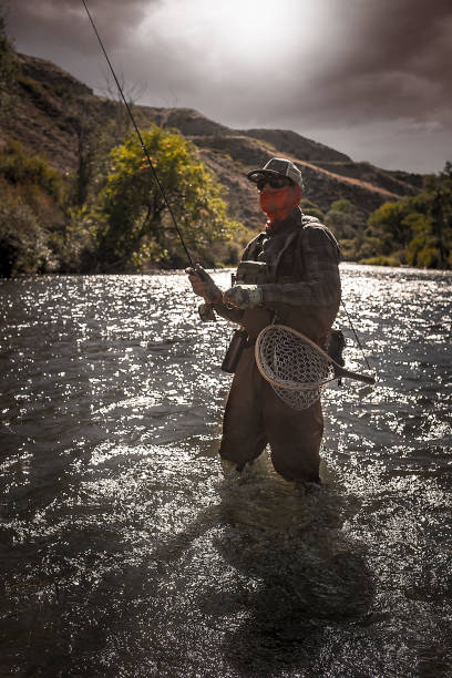 istock Tactical Fly Fisherman In The River 1044964848