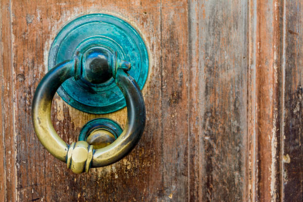 istock old green handle on a wooden door 1044964912