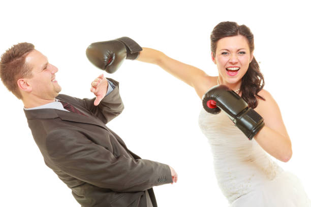 istock Bride boxing her groom on wedding 1044965122
