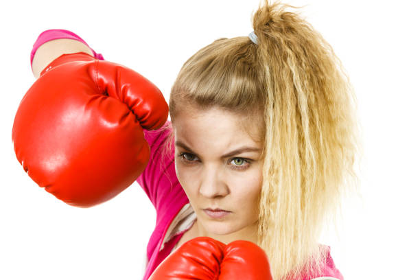 istock Woman wearing boxing gloves 1044965128