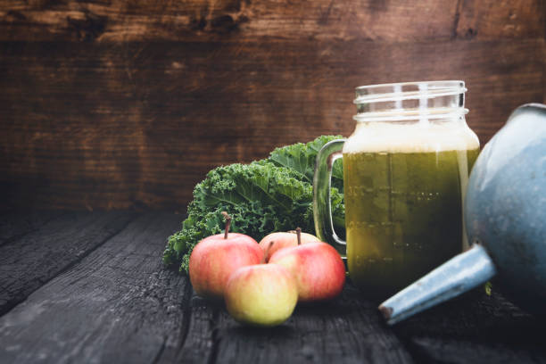 istock Detox juice on wooden background 1044967324