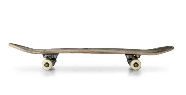 Old skateboard isolated on white