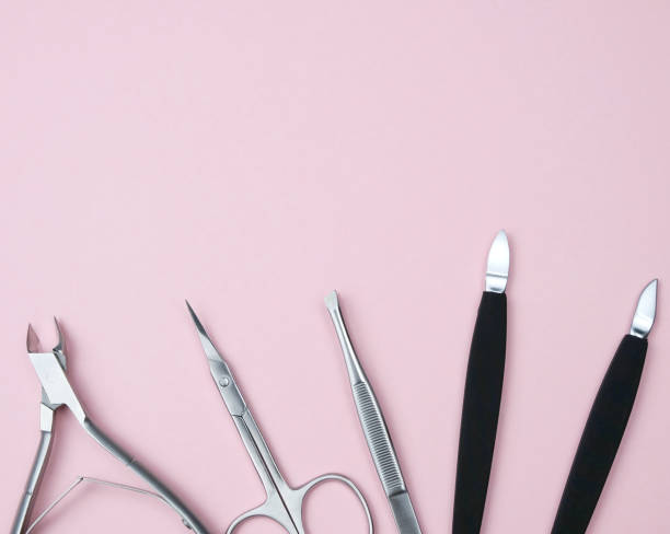 istock Composition With Manicure Tools. Scissors For Nails, Tweezers, Forceps On The Geometric Pastel Pink Colors Background Minimal Style Flat Lay Copy Space Long Banner 1044968248