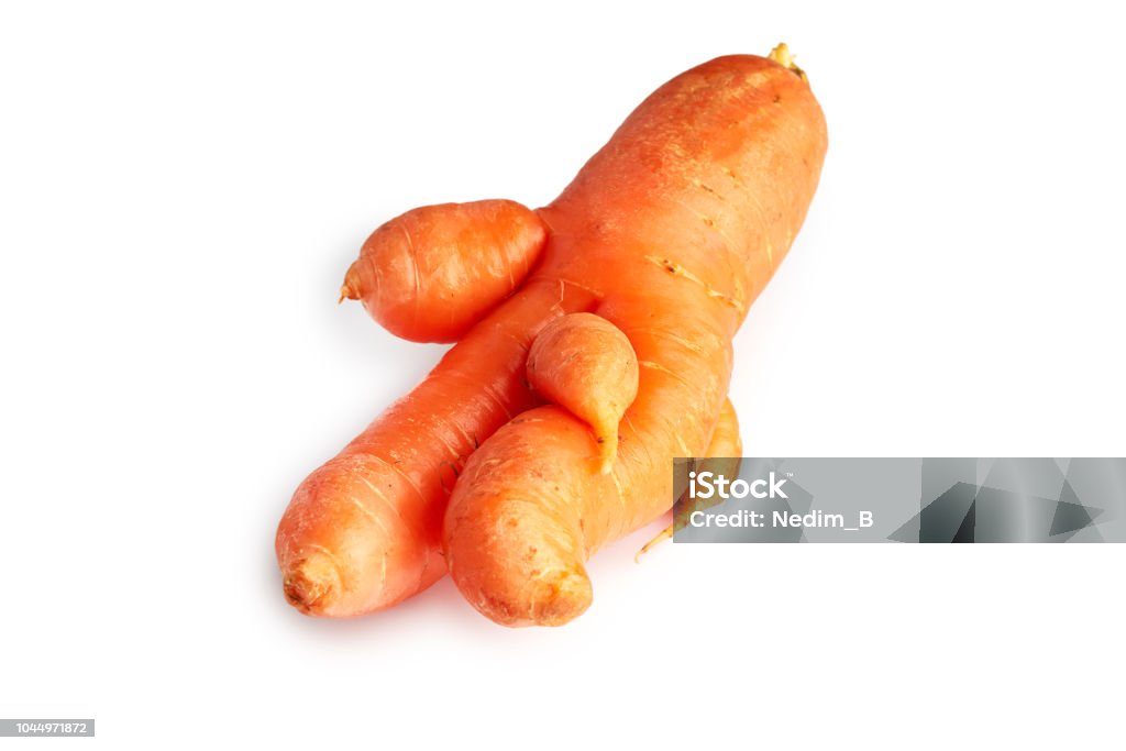 Imperfect organic carrot Imperfect fresh organic carrot isolated on white background Carrot Stock Photo