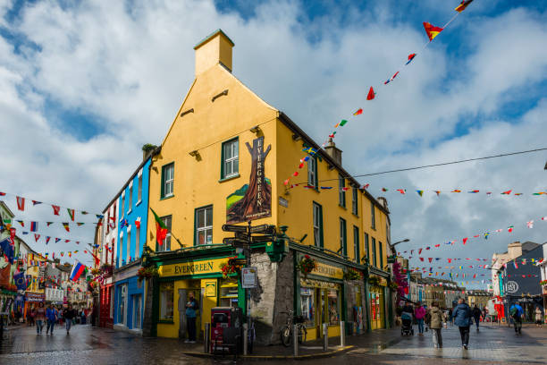 Galway Galway, Ireland - August 07, 2018: People walking along one of the main pedestrian streets in Galway. It is full of shops, pubs and restaurants. county galway stock pictures, royalty-free photos & images