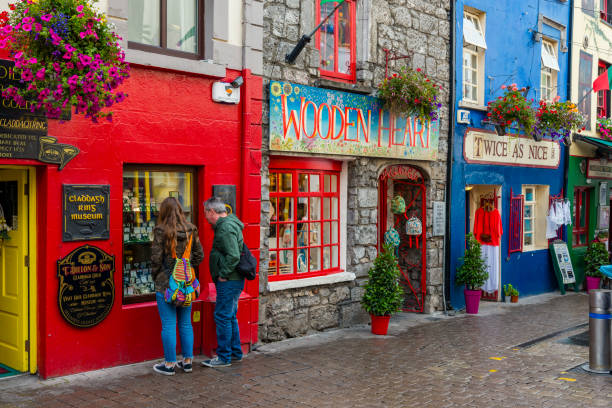 Galway Galway, Ireland - August 07, 2018: Shops, pubs and restaurants along one of the main pedestrian streets in Galway. county galway stock pictures, royalty-free photos & images