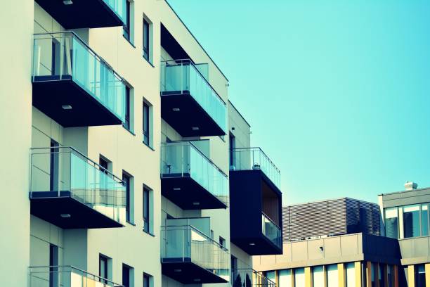 istock Modern apartment building exterior. Retro colors stylization 1044975472