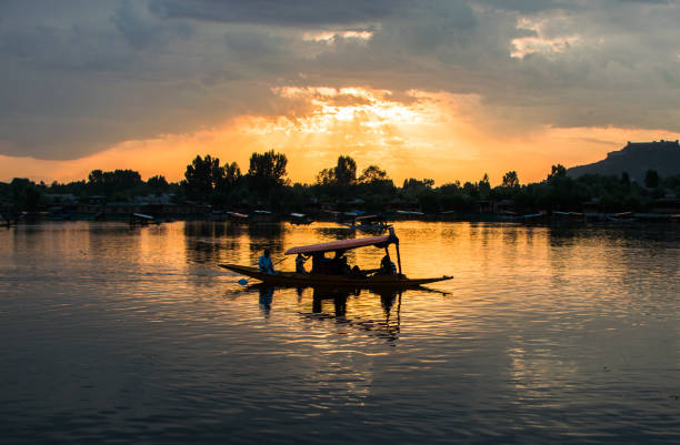 istock Reflection of a Shikara in Dal Lake 1044979104