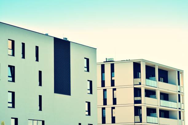 istock Modern apartment building exterior. Retro colors stylization 1044979596