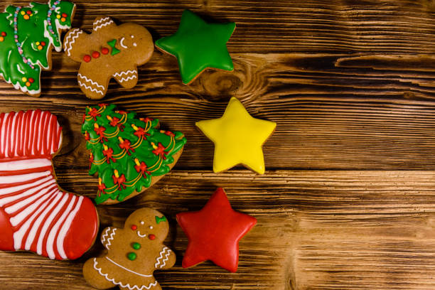 istock Different christmas gingerbread cookies on wooden table. Top view 1044980274