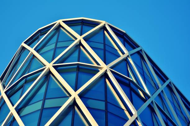 istock Modern office building on a clear sky background. Retro stylized colorful tonal filter effect 1044980498