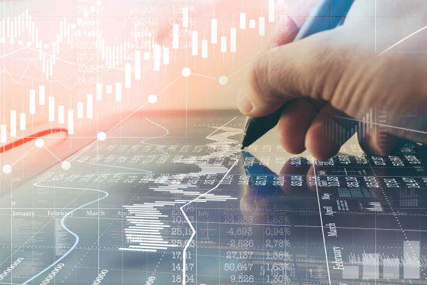 istock Man is working on virtual business charts. 1044982922