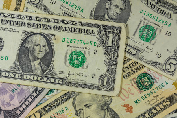 istock Background of different american dollar banknotes 1044985288
