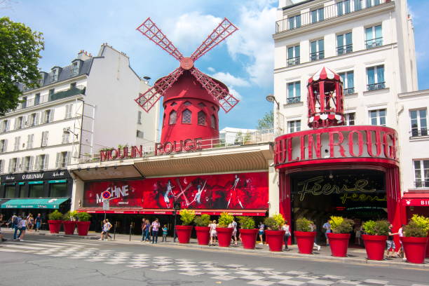 Moulin Rouge cabaret in Paris, France PARIS, FRANCE - CIRCA MAY 2018: Moulin Rouge cabaret in Paris place pigalle stock pictures, royalty-free photos & images