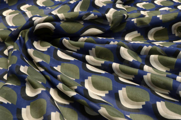 istock Cotton fabric, BATIST BLUE-PURPLE STILIZED polka dots 1044986344