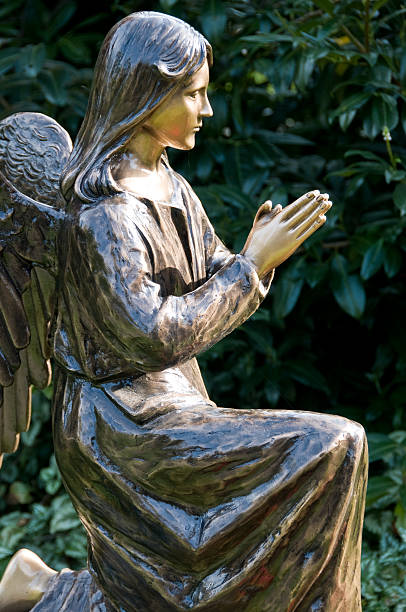 istock Statue of angel at prayer 104499380