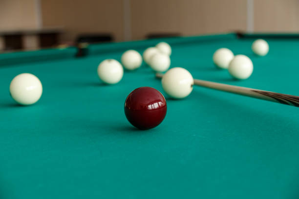 istock Russian billiard table with balls and cue sticks. 1044994334