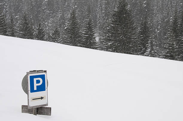istock Sign to car park covered with snow 104499629
