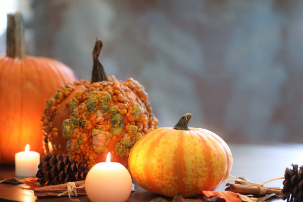 istock Halloween, autumn scene with pumpkins and candles. 1045002190