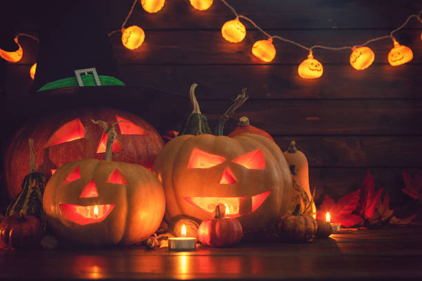 istock Jack O’ Lanterns on The Old Wooden Background 1045008670