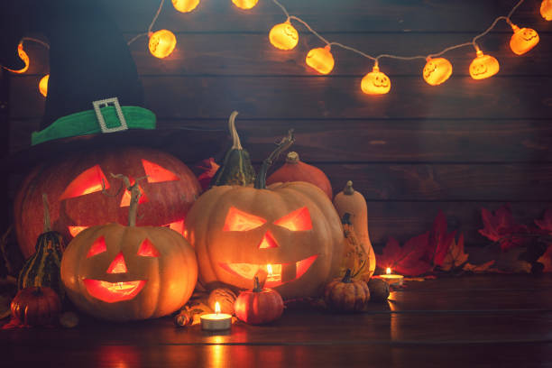 istock Jack O’ Lanterns on The Old Wooden Background 1045008700