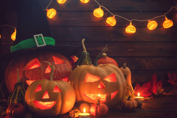 istock Jack O’ Lanterns on The Old Wooden Background 1045008728