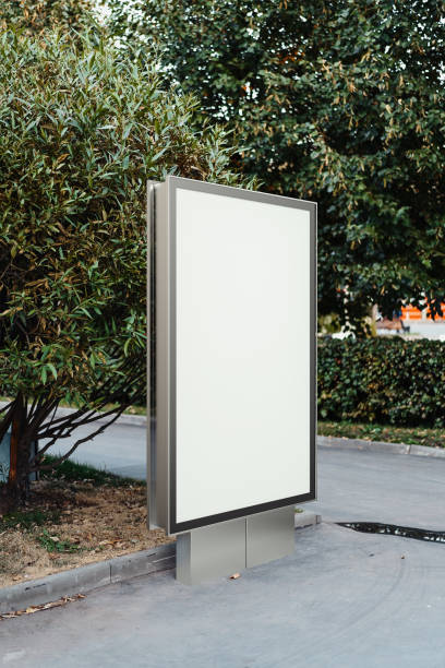 istock Blank canvas banner stand at park. Empty billboard advertising. 3d rendering. 1045008764