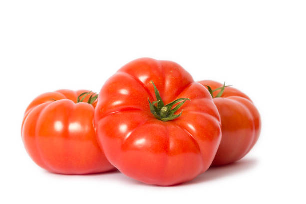 istock big red meat tomatoes isolated on awhite background 1045008982