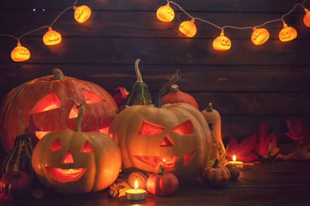 istock Jack O’ Lanterns on The Old Wooden Background 1045009234