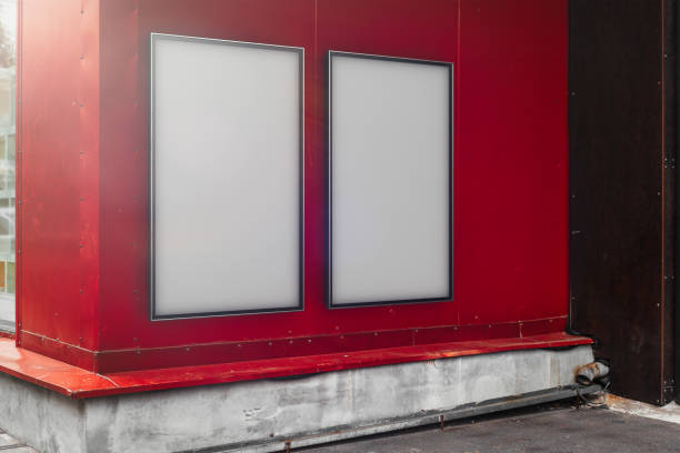 istock Two blank white outdoor banners at modern building red wall, 3d rendering. 1045011840