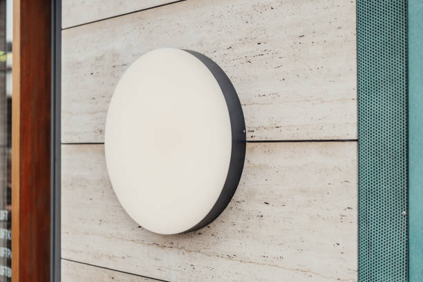 istock Blank round store signboard. Empty shop lightbox on the wall. 1045012058