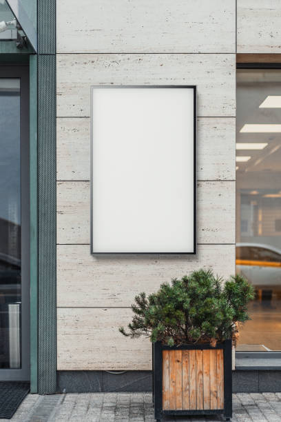istock Blank white outdoor banner at bright modern building wall, 3d rendering. 1045012076
