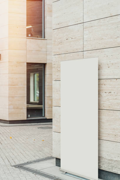 istock Blank roll up at street next to modern building, 3d rendering. 1045012666