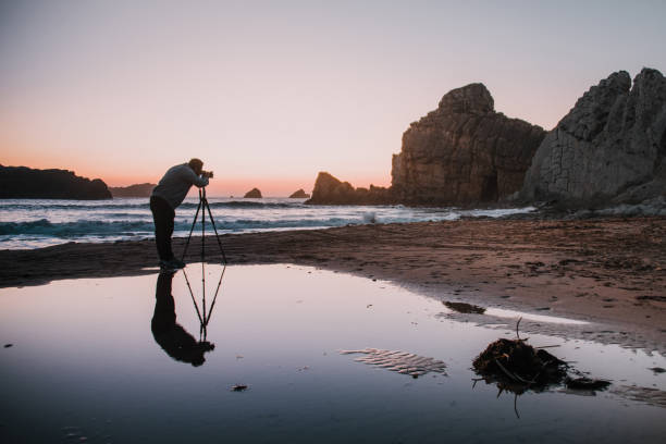 photographer with tripod at sunset - nature photographer imagens e fotografias de stock