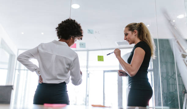 istock Female colleagues discussing business ideas 1045021634