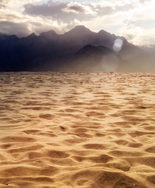 istock Dried landscape with high mountains and cloudy sky 1045026062