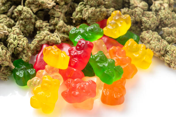 Organic Marijuana Gummy Bear Candies Stack of Organic Marijuana Gummy Bear Candies close up cannabis gummy bears stock pictures, royalty-free photos & images