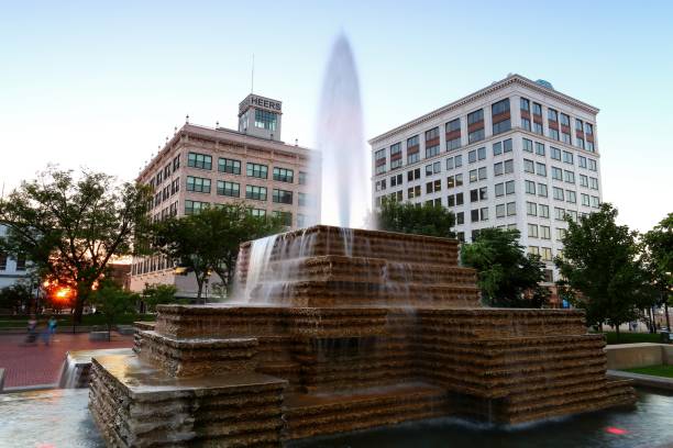 park central square Springfield Missouri - September 13 2018 Office buildings and fountain at sunset on the town square in Springfield Missouri. springfield missouri photos stock pictures, royalty-free photos & images