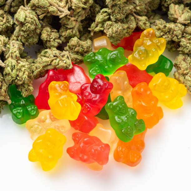 Organic Marijuana Gummy Bear Candies Stack of Organic Marijuana Gummy Bear Candies close up cannabis gummy bears stock pictures, royalty-free photos & images