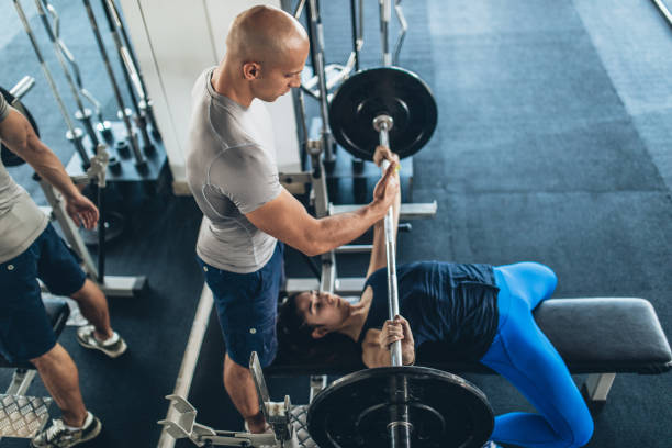 Man training a man in gym