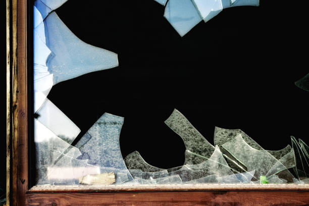 istock Close up broken wooden frame glass window 1045036288
