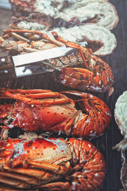 istock Lobster tails cooking on grill 1045038918