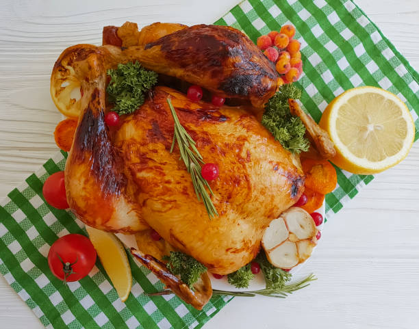 istock fried chicken whole, lemon, garlic on a wooden background 1045039250
