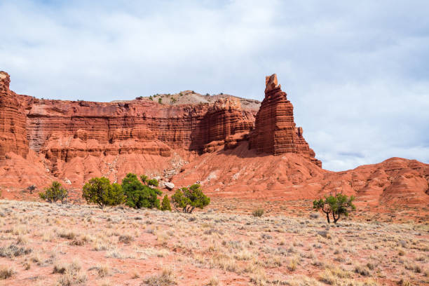 istock Capitol Reef National Park is characterized by sandstone formations, and canyons, and the carved cliff called Chimney Rock. 1045043686