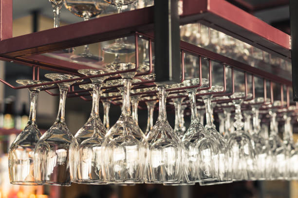 istock A row of clean empty wine glasses hang 1045048412
