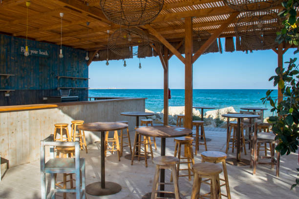 Beach Bar near the beach Tables And Chairs On The Sea View Terrace beach bar stock pictures, royalty-free photos & images